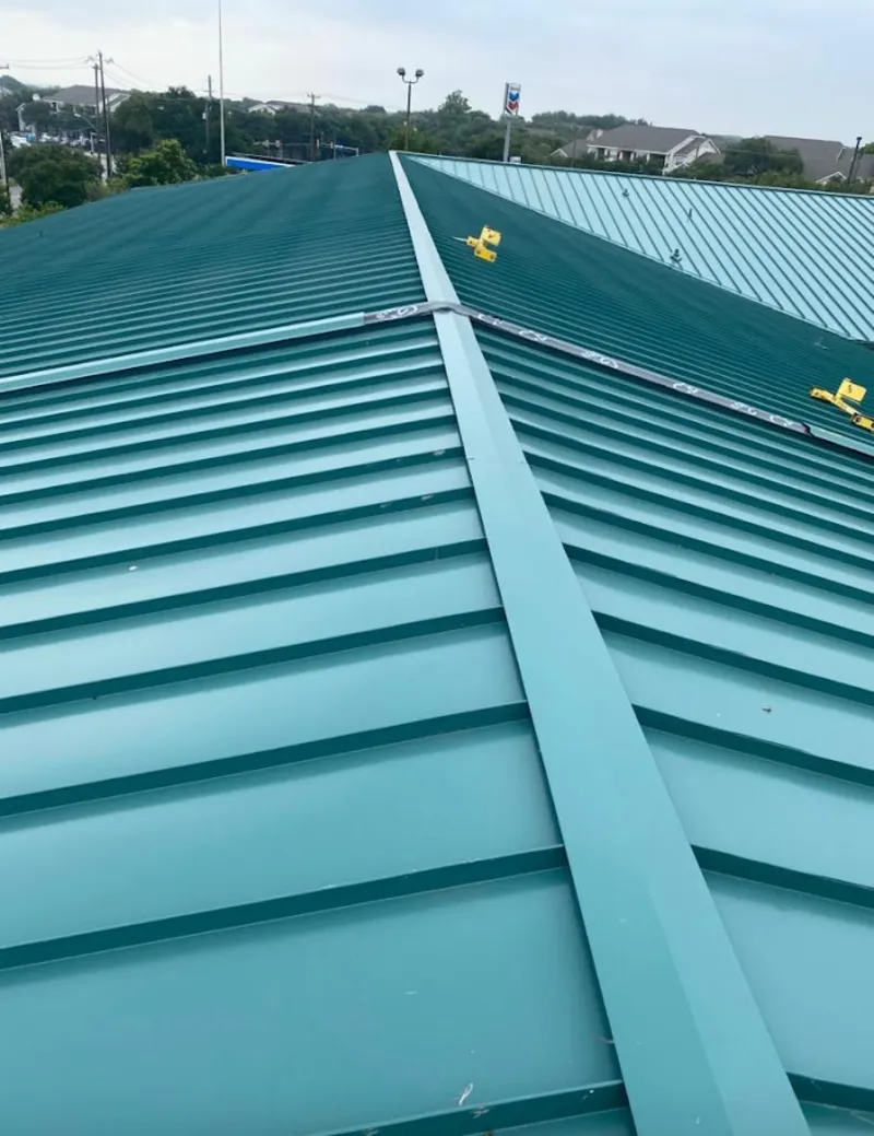 Green commercial metal roof ridge and valley for Metal Roof Repair in North Aurora